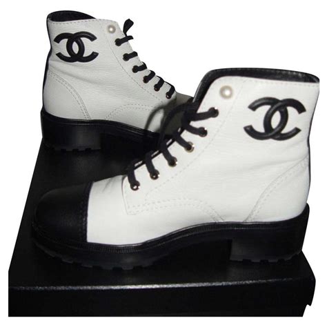 white chanel boots.